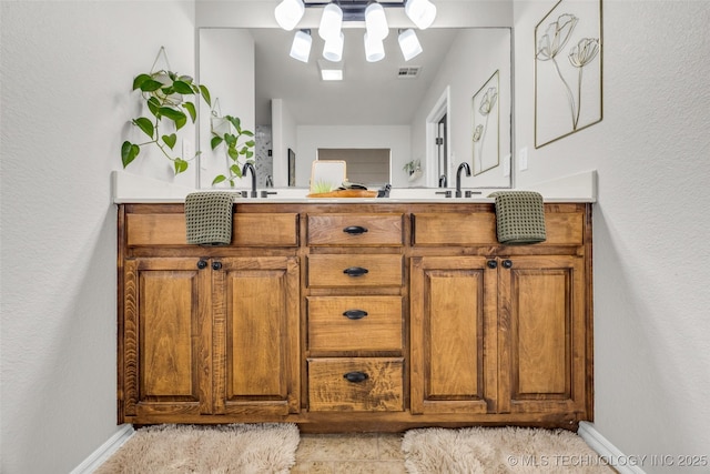 1116 W Fargo Dr, Broken Arrow, OK 74012 - full bath with double vanity and baseboards