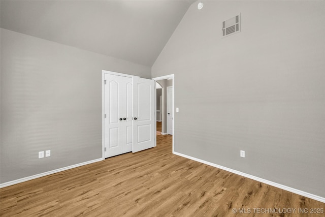1116 W Fargo Dr, Broken Arrow, OK 74012 - unfurnished bedroom with high vaulted ceiling and wood finished floors