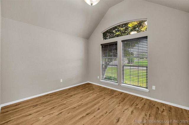 1116 W Fargo Dr, Broken Arrow, OK 74012 - spare room with lofted ceiling, wood finished floors, and plenty of natural light