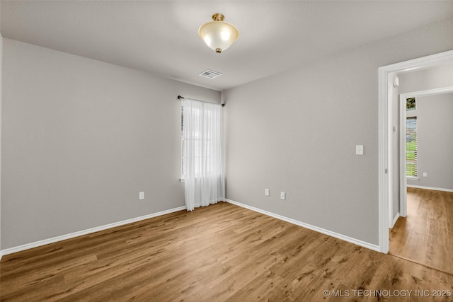 1116 W Fargo Dr, Broken Arrow, OK 74012 - empty room with plenty of natural light and wood finished floors