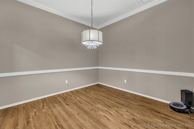 1116 W Fargo Dr, Broken Arrow, OK 74012 - empty room featuring ornamental molding, wood finished floors, and a chandelier