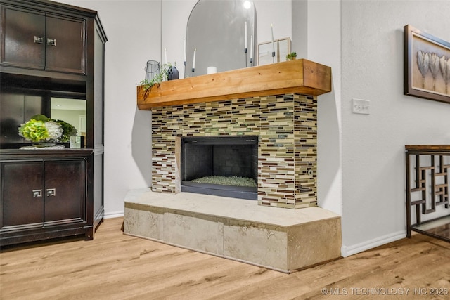 1116 W Fargo Dr, Broken Arrow, OK 74012 - detailed view of wood finished floors and a tile fireplace