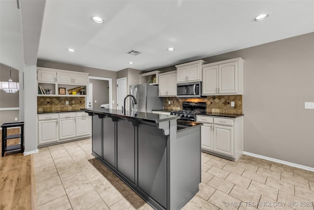 1116 W Fargo Dr, Broken Arrow, OK 74012 - kitchen with stainless steel appliances, open shelves, dark countertops, white cabinets, and recessed lighting