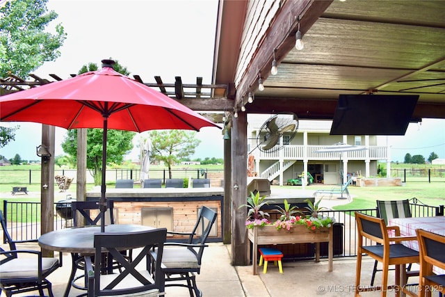 71279 S 270th Rd, Wagoner, OK 74467 - view of patio / terrace featuring stairway, exterior kitchen, and outdoor dining area