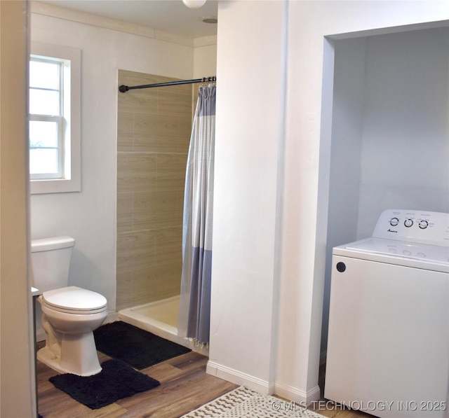 71279 S 270th Rd, Wagoner, OK 74467 - bathroom with washer / dryer, tiled shower, and wood finished floors