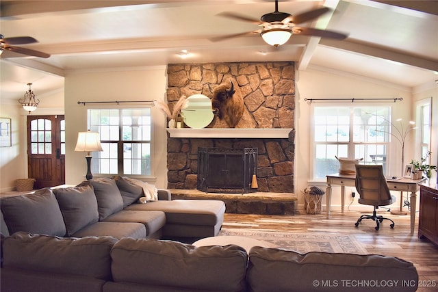 71279 S 270th Rd, Wagoner, OK 74467 - living room featuring a ceiling fan, wood finished floors, plenty of natural light, and a stone fireplace