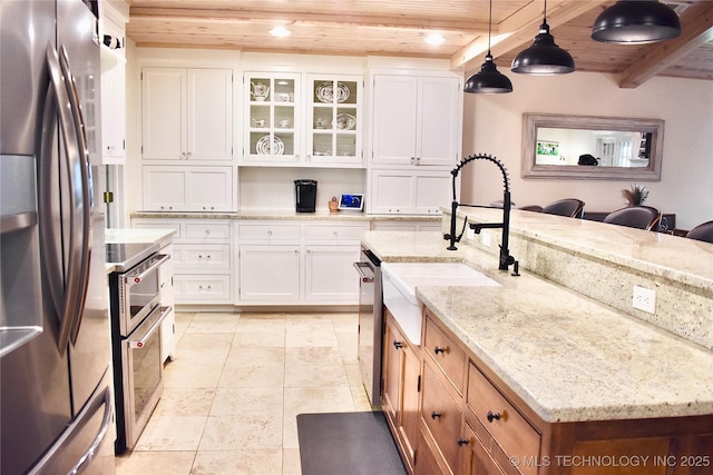 71279 S 270th Rd, Wagoner, OK 74467 - kitchen with appliances with stainless steel finishes, a wooden ceiling with exposed beams, light stone counters, glass insert cabinets, and recessed lighting