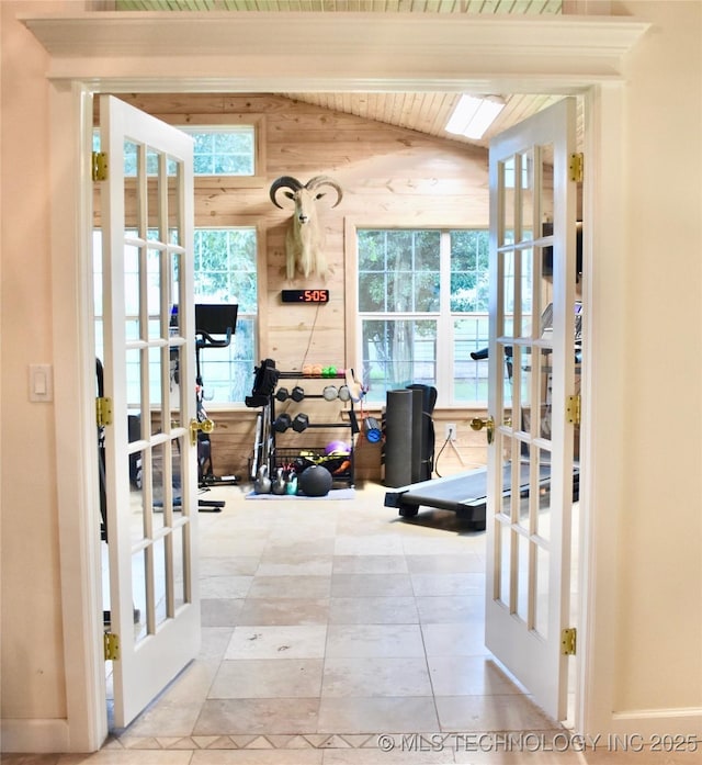 71279 S 270th Rd, Wagoner, OK 74467 - workout room featuring french doors, wooden ceiling, tile patterned flooring, wooden walls, and vaulted ceiling