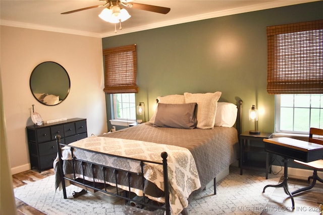 71279 S 270th Rd, Wagoner, OK 74467 - bedroom featuring multiple windows, crown molding, a ceiling fan, and wood finished floors