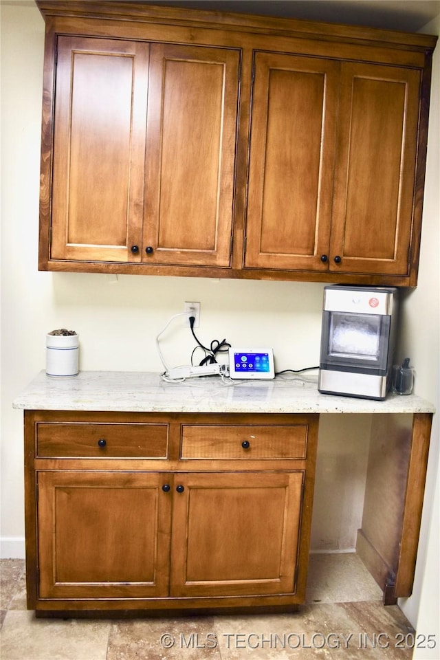 71279 S 270th Rd, Wagoner, OK 74467 - kitchen featuring brown cabinetry and light stone countertops