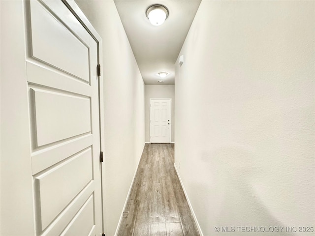 3907 S 150th E Ave, Tulsa, OK 74134 - hallway featuring wood finished floors and baseboards