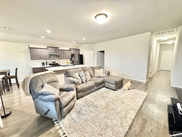 3907 S 150th E Ave, Tulsa, OK 74134 - living area featuring light wood-style flooring and recessed lighting