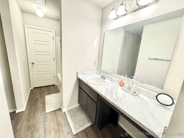 3907 S 150th E Ave, Tulsa, OK 74134 - bathroom with wood finished floors and vanity