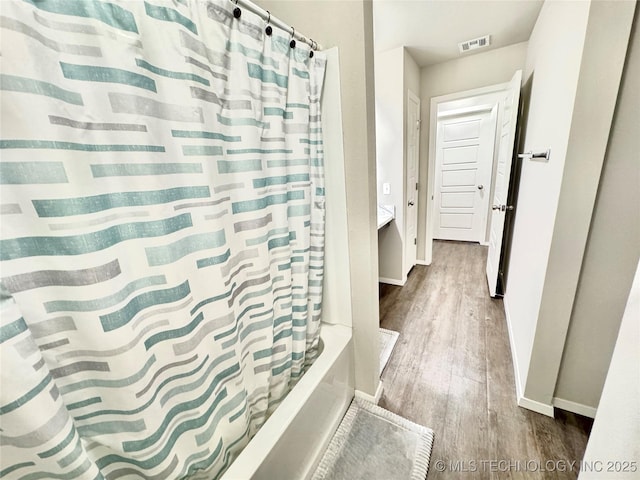 3907 S 150th E Ave, Tulsa, OK 74134 - full bath with wood finished floors and shower / bath combo