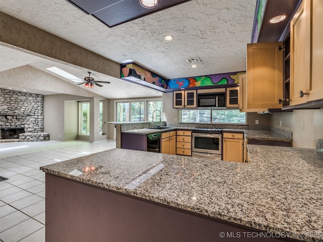 5704 E 65th St, Tulsa, OK 74136 - kitchen with black appliances, a peninsula, open floor plan, light tile patterned floors, and a textured ceiling