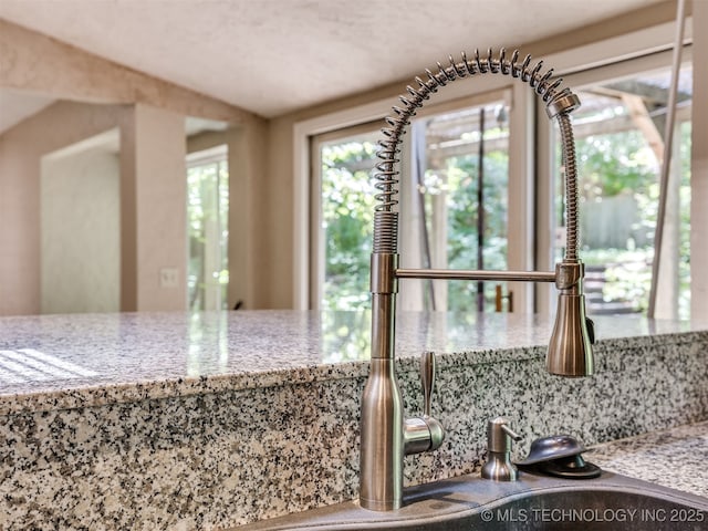 5704 E 65th St, Tulsa, OK 74136 - kitchen with light stone counters and backsplash