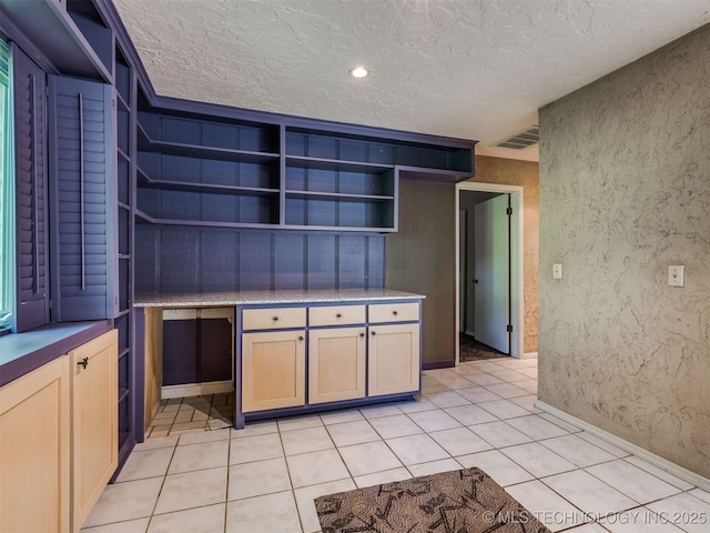5704 E 65th St, Tulsa, OK 74136 - kitchen with open shelves, a textured ceiling, light tile patterned floors, and light brown cabinetry