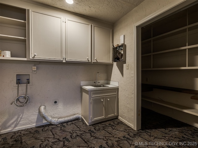 5704 E 65th St, Tulsa, OK 74136 - laundry area featuring cabinet space, dark colored carpet, hookup for an electric dryer, washer hookup, and a textured ceiling