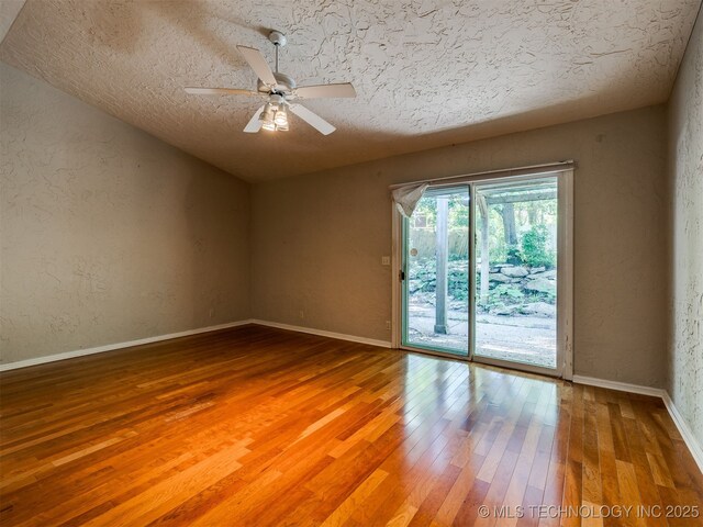 5704 E 65th St, Tulsa, OK 74136 - empty room with hardwood / wood-style floors, a ceiling fan, a textured ceiling, and a textured wall