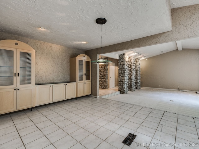 5704 E 65th St, Tulsa, OK 74136 - unfurnished dining area featuring a textured ceiling and lofted ceiling