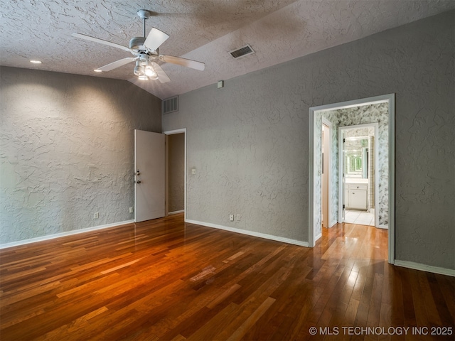 5704 E 65th St, Tulsa, OK 74136 - empty room featuring a textured wall, wood-type flooring, a textured ceiling, a ceiling fan, and vaulted ceiling