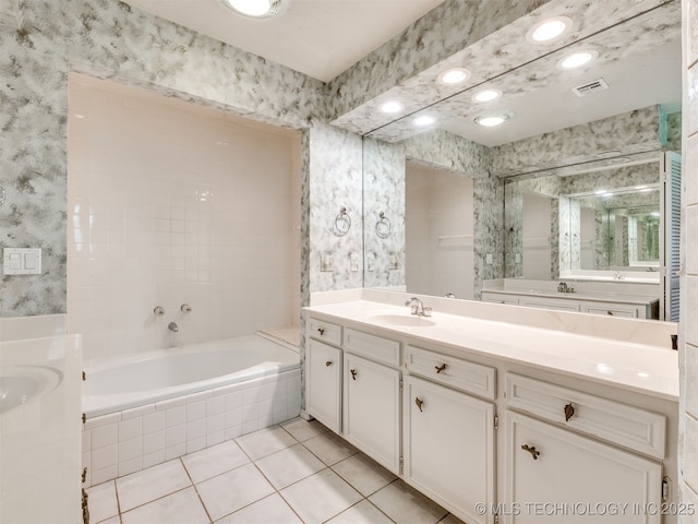 5704 E 65th St, Tulsa, OK 74136 - bathroom featuring wallpapered walls, tile patterned flooring, vanity, and a bath