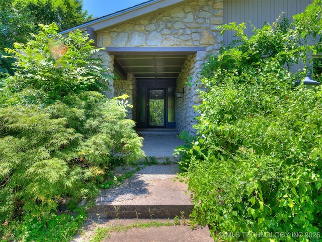 5704 E 65th St, Tulsa, OK 74136 - property entrance featuring stone siding