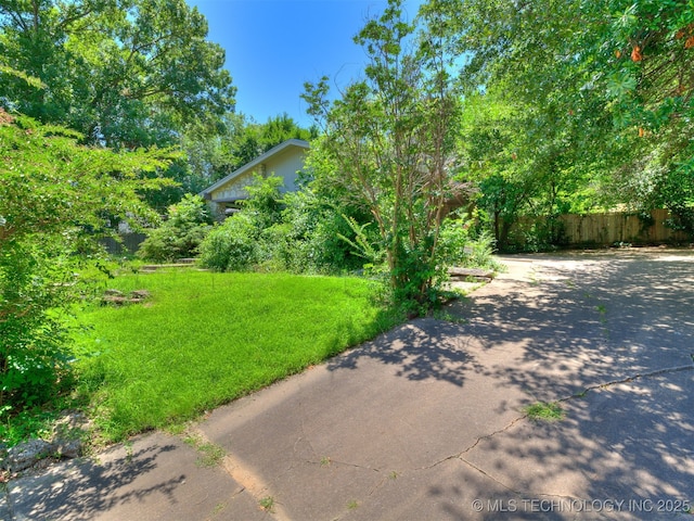 5704 E 65th St, Tulsa, OK 74136 - view of yard with driveway