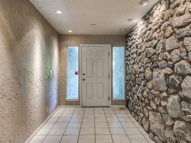 5704 E 65th St, Tulsa, OK 74136 - entryway with light tile patterned flooring and recessed lighting