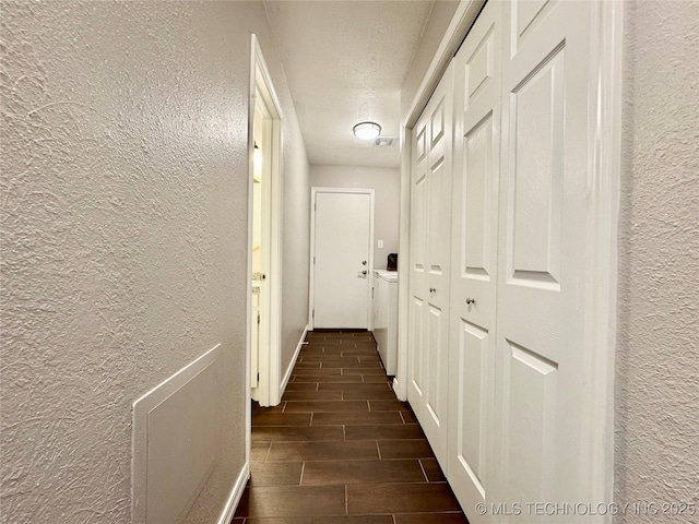 1404 Compelube Rd, Mcalester, OK 74501 - hallway featuring a textured wall and wood tiled floors
