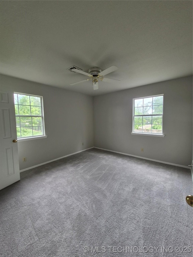 2200 SW Wolf Run Ct, Claremore, OK 74019 - carpeted spare room with healthy amount of natural light and ceiling fan