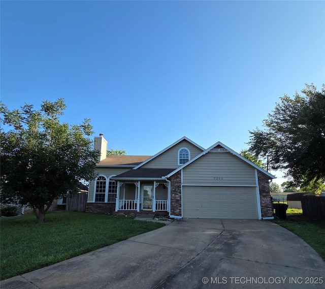 2200 SW Wolf Run Ct, Claremore, OK 74019 - view of front of home featuring concrete driveway, a garage, a chimney, and covered porch