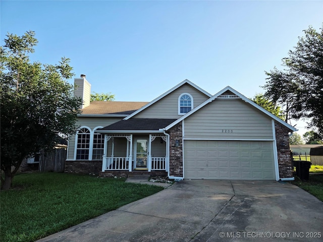 2200 SW Wolf Run Ct, Claremore, OK 74019 - view of front of property with driveway, a porch, an attached garage, a chimney, and brick siding