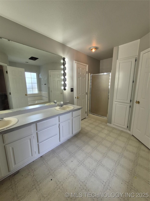 2200 SW Wolf Run Ct, Claremore, OK 74019 - bathroom with tile patterned floors, a stall shower, and double vanity