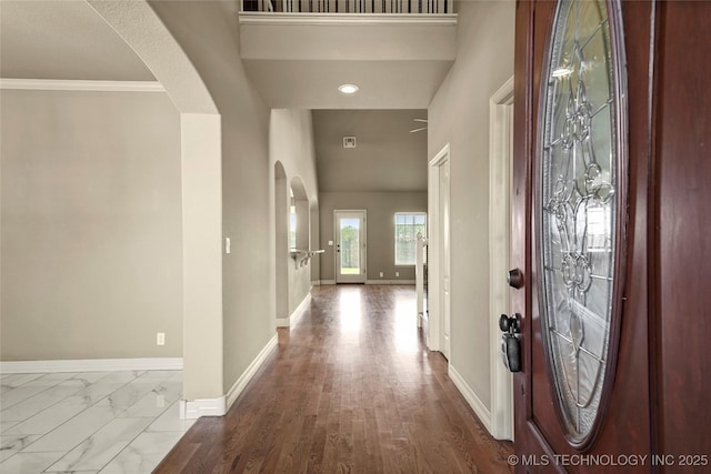 1317 W Dover St, Broken Arrow, OK 74012 - entrance foyer with arched walkways, a high ceiling, and ornamental molding