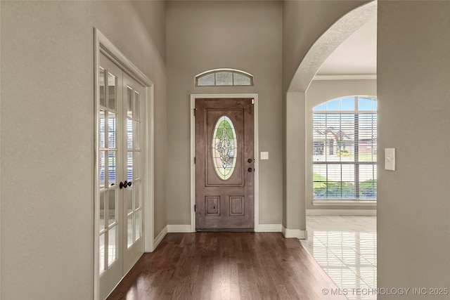1317 W Dover St, Broken Arrow, OK 74012 - entryway with arched walkways, wood finished floors, and french doors
