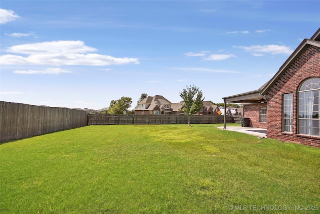 1317 W Dover St, Broken Arrow, OK 74012 - fenced backyard with a patio area