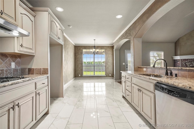 1317 W Dover St, Broken Arrow, OK 74012 - kitchen featuring appliances with stainless steel finishes, under cabinet range hood, arched walkways, light marble finish flooring, and a chandelier
