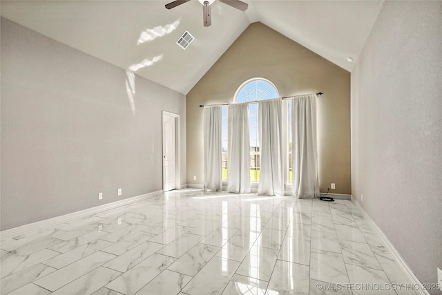 1317 W Dover St, Broken Arrow, OK 74012 - spare room featuring ceiling fan, marble look tiles, and high vaulted ceiling