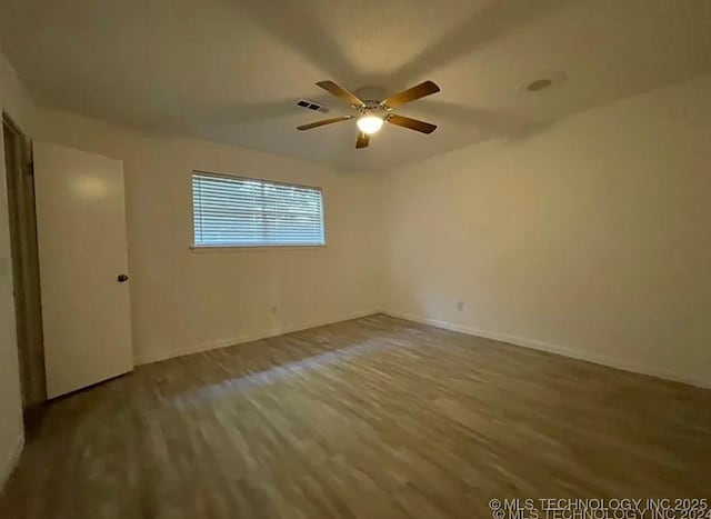 802 N Main St, Wagoner, OK 74467 - spare room featuring wood finished floors and ceiling fan