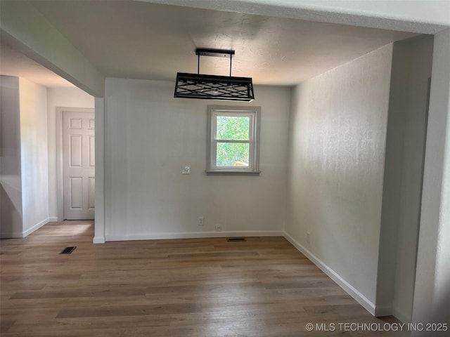 115 S Bryan St, Sperry, OK 74073 - unfurnished dining area with wood finished floors and baseboards