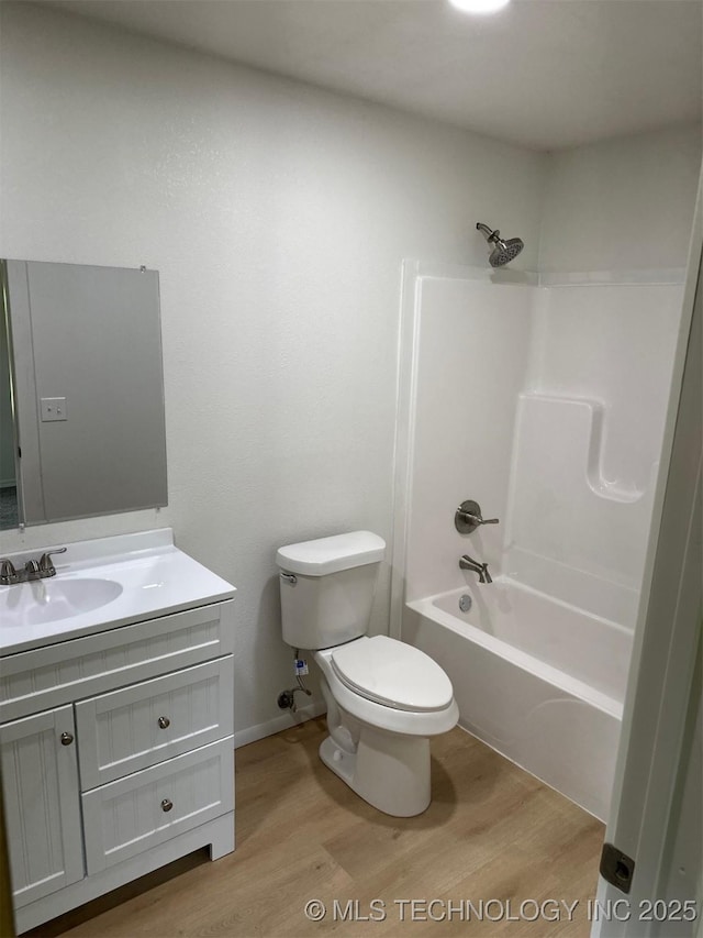 115 S Bryan St, Sperry, OK 74073 - bathroom featuring wood finished floors, vanity, and shower / bathtub combination