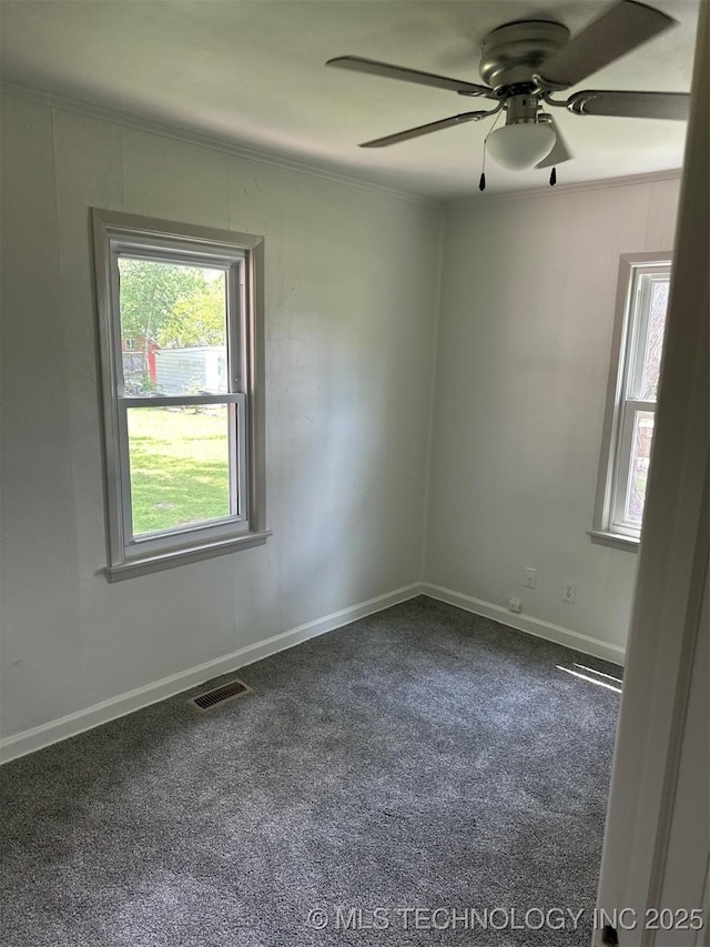 115 S Bryan St, Sperry, OK 74073 - carpeted empty room with plenty of natural light, ornamental molding, and ceiling fan