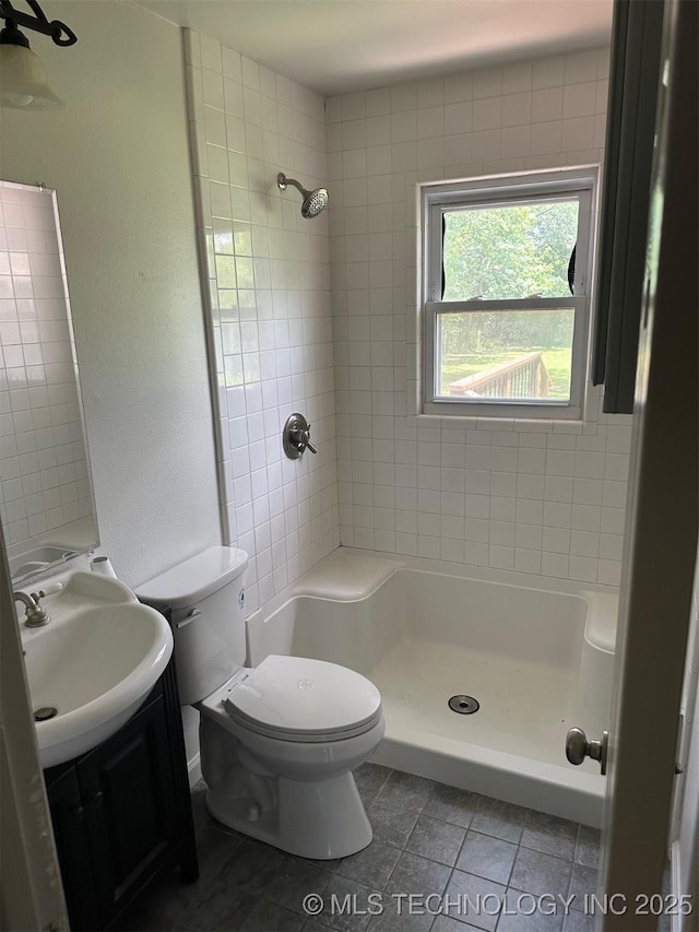 115 S Bryan St, Sperry, OK 74073 - bathroom with vanity, tile patterned flooring, and a tile shower