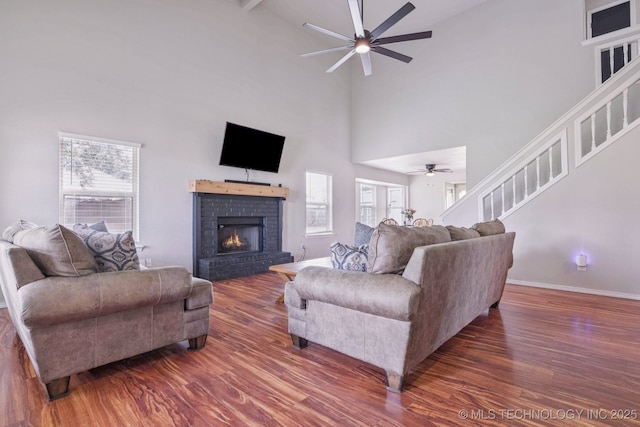 11784 N 154th Ave, Collinsville, OK 74021 - living area featuring a ceiling fan, wood finished floors, plenty of natural light, a high ceiling, and stairway