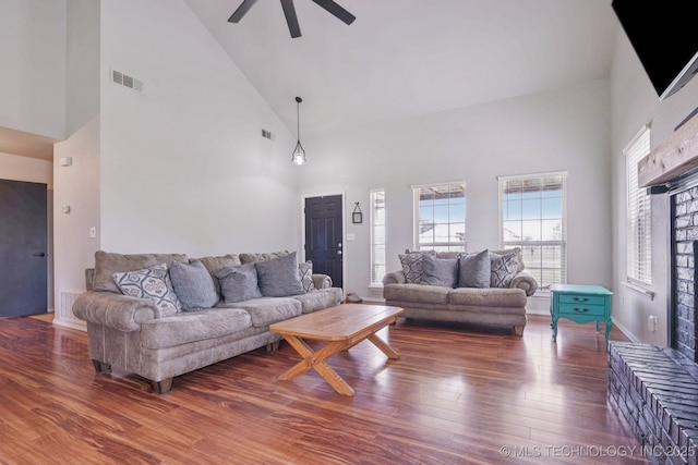 11784 N 154th Ave, Collinsville, OK 74021 - living room featuring high vaulted ceiling, ceiling fan, and wood finished floors