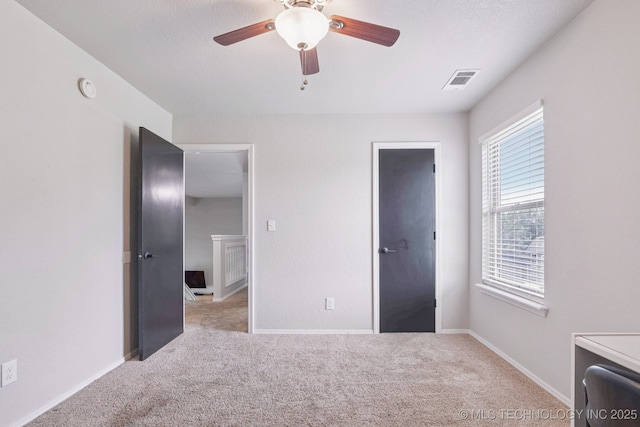 11784 N 154th Ave, Collinsville, OK 74021 - unfurnished bedroom featuring carpet flooring and a ceiling fan