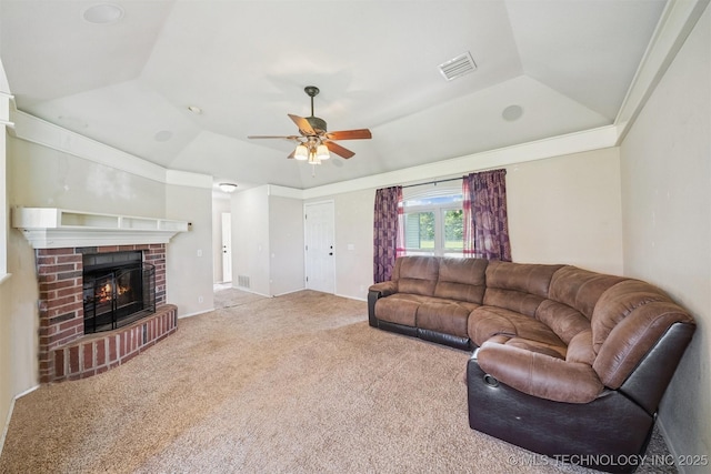 11691 N 193rd E Ave, Collinsville, OK 74021 - living room featuring a raised ceiling, a ceiling fan, carpet, and a fireplace