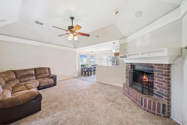 11691 N 193rd E Ave, Collinsville, OK 74021 - carpeted living room with a fireplace, a ceiling fan, a tray ceiling, and vaulted ceiling