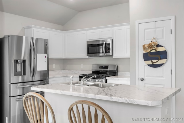 11608 S 274th E Pl, Coweta, OK 74429 - kitchen featuring stainless steel appliances, lofted ceiling, white cabinetry, a center island with sink, and light stone counters